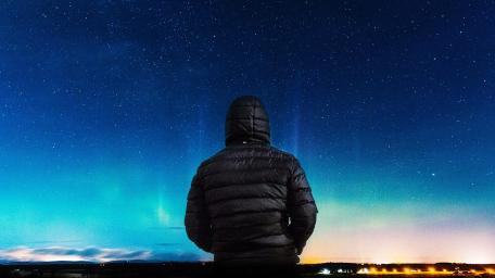 Alone boy in hoodie jacket looking towards at night wallpaper