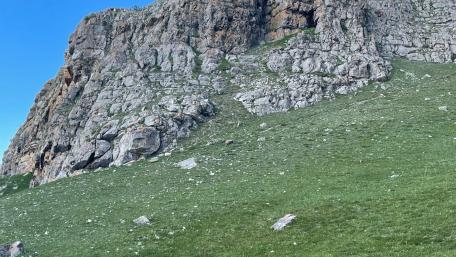 Majestic Rocky Terrain Under a Clear Blue Sky wallpaper