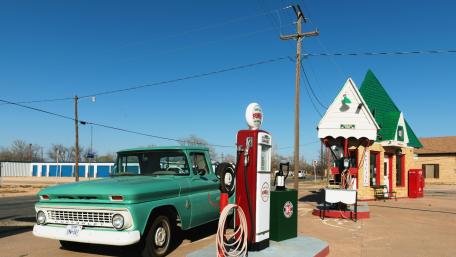 Vintage Gas Station Scene with Classic Pickup Truck wallpaper