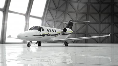 Sleek Cessna Aircraft in Modern Hangar Setting wallpaper