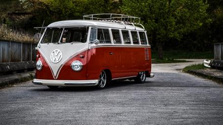 Classic Volkswagen Bus on a Scenic Road wallpaper