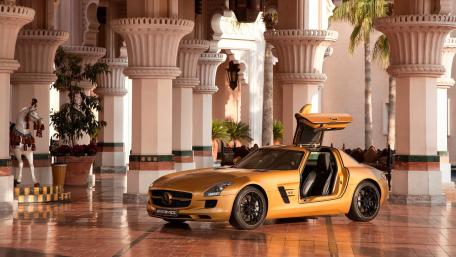 Golden Mercedes SLS Set in Luxurious Architecture wallpaper