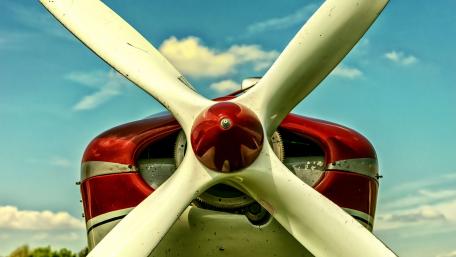 Classic Airplane Propeller Against a Blue Sky wallpaper