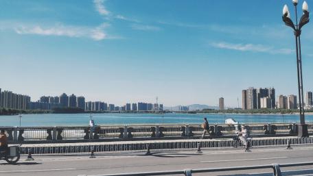 Vibrant Cityscape Under Clear Blue Sky wallpaper
