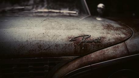 Rusty Vintage Plymouth Car Beauty Unveiled wallpaper