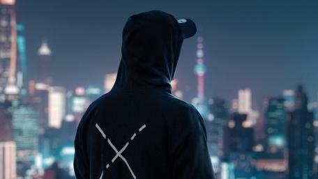 Mysterious Gaze Over Nocturnal Cityscape wallpaper