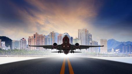 Airplane Taking Off in a Urban Landscape View wallpaper