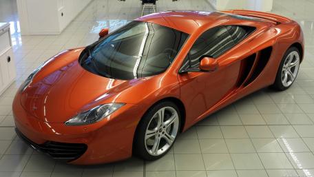 Sleek McLaren MP4-12C in Radiant Orange Shine wallpaper