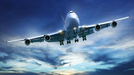 Majestic Boeing 747 in Flight Over Dramatic Sky wallpaper