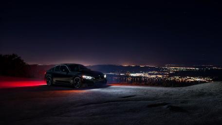 Sleek BMW Under Starry Night Sky wallpaper