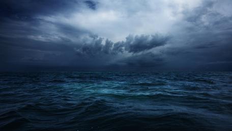 Mystical Ocean Under Stormy Skies wallpaper