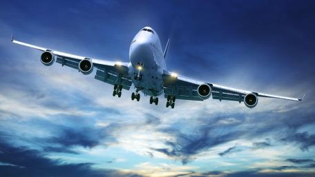 Majestic Boeing 747 in Flight Above the Clouds wallpaper