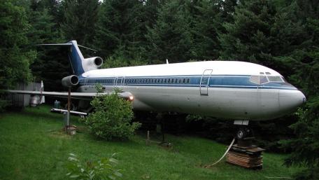 Vintage Boeing 727 in Nature's Embrace wallpaper
