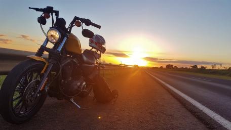 Cruiser Motorcycle at Sunset on the Open Road wallpaper