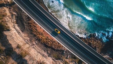 Scenic Coastal Drive Captured from Above wallpaper