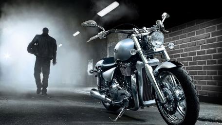 Sleek Chopper Under Urban Lights wallpaper