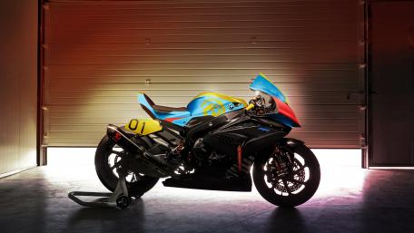 Sleek BMW Motorcycle in a Modern Garage Setting wallpaper