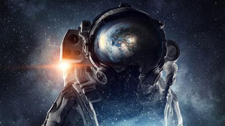 Astronaut Gazing Upon Earth wallpaper