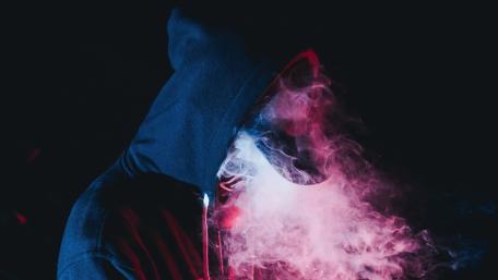 Ethereal Mystery Hooded Figure in Smoke wallpaper
