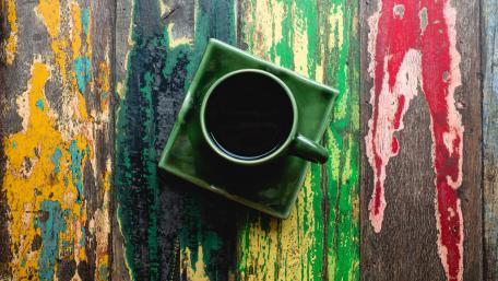 Vibrant Coffee Moment on Rustic Planks wallpaper