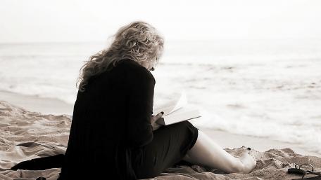 Woman reading book wallpaper
