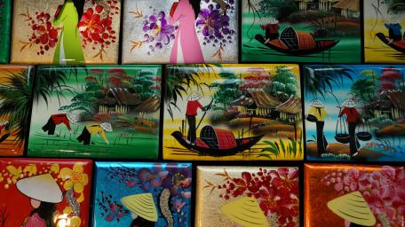 Colorful Collage of Traditional Scenes in Vibrant Patterns wallpaper