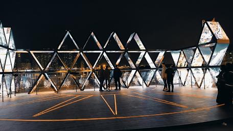 Modern Architectural Marvel Under Night Sky in UAE Cityscape wallpaper