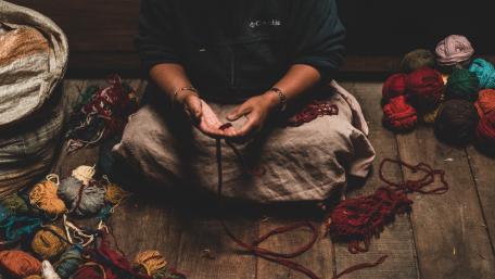Crafting Resilience Through Hands and Yarn wallpaper
