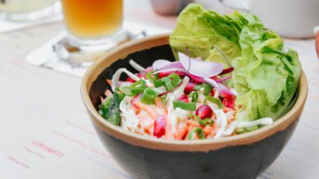 Fresh and Vibrant Salad Bowl with Leafy Greens and Colors wallpaper