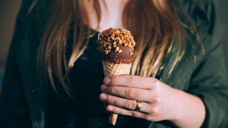 Delicious Ice Cream Delight in Hand wallpaper