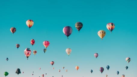 Vibrant Hot Air Balloons in Clear Sky wallpaper