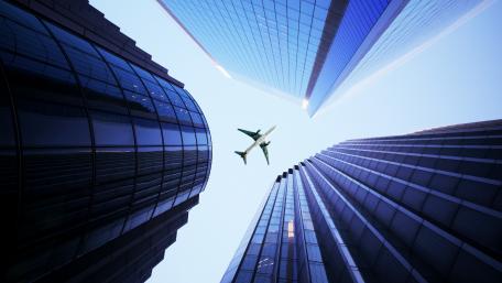 Majestic Flight Above Skyscrapers wallpaper