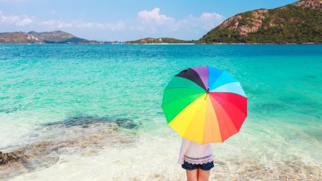 Vibrant Umbrella by the Sea wallpaper