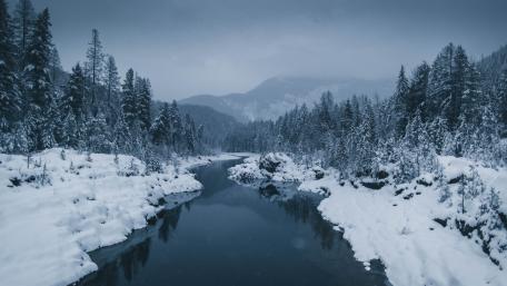 Winter Wonderland with Serene River Views wallpaper