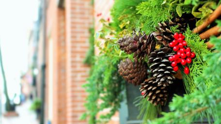 Rustic Christmas Decor with Pinecones and Berries wallpaper