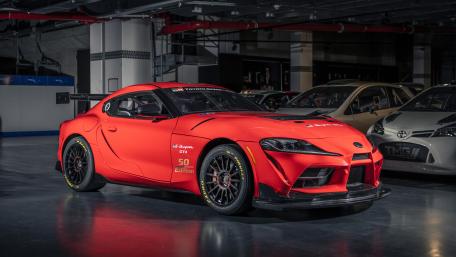 8K Sleek Red Toyota GR Supra GT4 Sports Car wallpaper