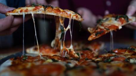 Deliciously Cheesy Pizza Close-Up Wallpaper wallpaper
