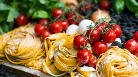 Delicious Italian Pasta and Fresh Tomatoes Wallpaper wallpaper