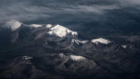 Majestic Mountain Peaks in Shadowed Snow wallpaper