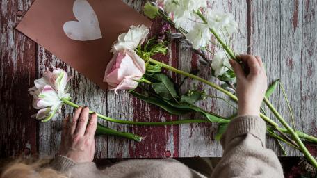 Charming Floral Arrangement on Rustic Wood Background wallpaper