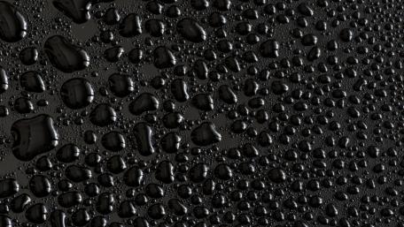 Black Dewdrops on Smooth Surface wallpaper