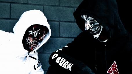 Mysterious Duo in Neon Masks wallpaper