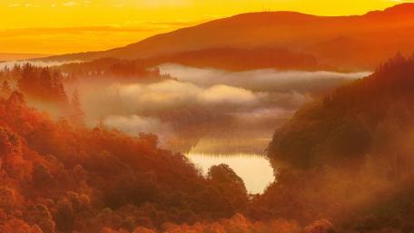 Golden Autumn Serenity Over Tranquil Lake wallpaper