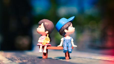 Cute Doll Couple on Romantic Bench wallpaper