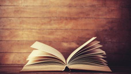 Timeless Pages on Wooden Surface wallpaper