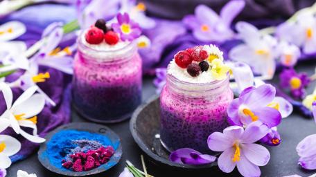 Vibrant Purple Smoothies Surrounded by Flowers wallpaper
