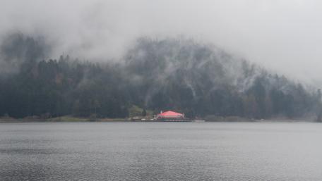 Serene Lake View Amidst Misty Mountains wallpaper