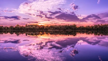 Purple Serenity Over Mirrored Lake wallpaper