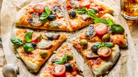 Delicious Italian Pizza with Fresh Ingredients wallpaper