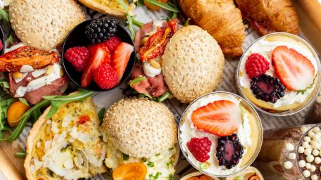Delicious Breakfast Spread with Fresh Berries and Croissants wallpaper